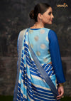 The stylish back view of the Vanya Sarees designer blouse, showcasing the dual-fabric design with a light blue brocade panel.