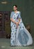 A full-length view of the model in Vanya Sarees' contemporary powder blue linen cotton saree with a bold polka dot print.