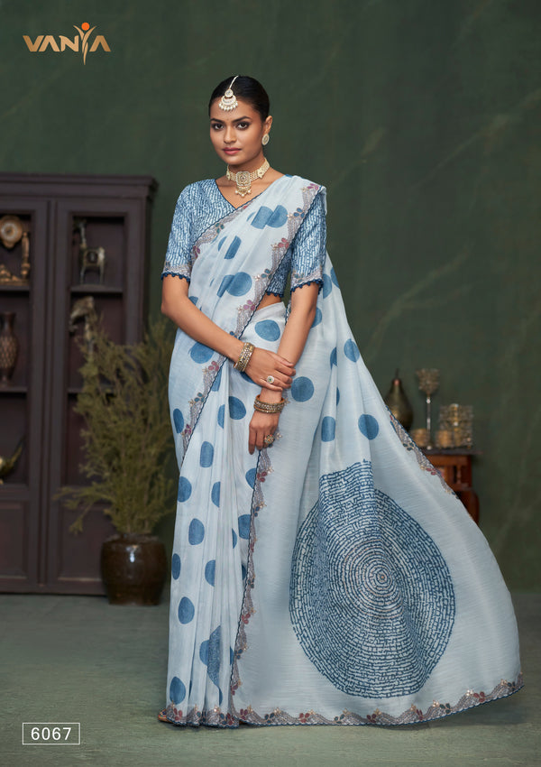 A full-length view of the model in Vanya Sarees' contemporary powder blue linen cotton saree with a bold polka dot print.