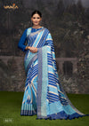 A full-length view of the model in Vanya Sarees' modern blue and white striped Dola silk saree with a designer blouse.