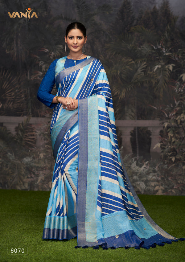 A full-length view of the model in Vanya Sarees' modern blue and white striped Dola silk saree with a designer blouse.
