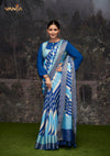 An elegant standing pose of the model showcasing the complete designer look of the Vanya Sarees blue striped Dola silk saree.