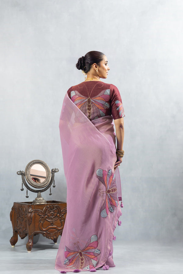 A full back view of the model in the Vanya Sarees ensemble, displaying the butterfly print pallu and the statement appliqué blouse.