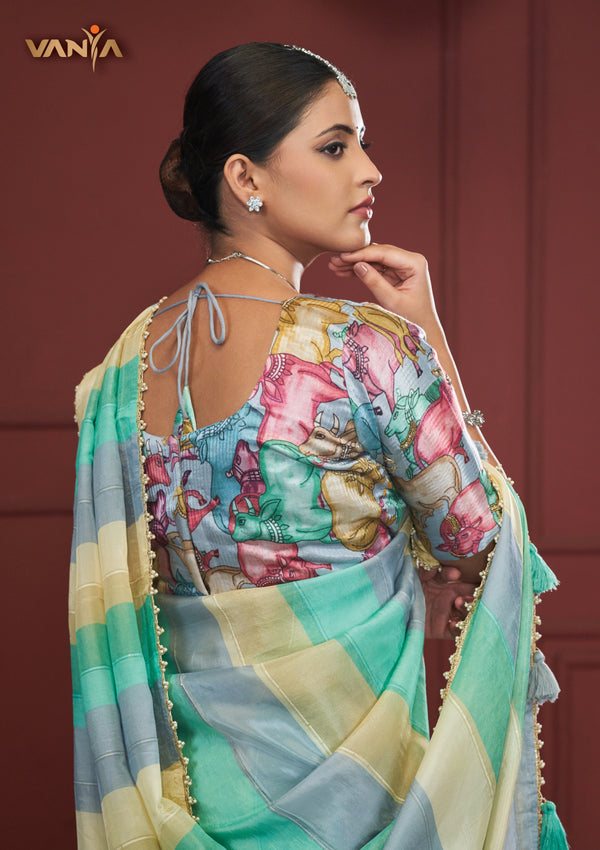 The stunning back view of the Vanya Sarees designer blouse, showcasing the rich multi-color Kalamkari-style print with elephant motifs.