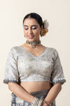 A clear front view of the readymade designer blouse from Vanya Sarees, highlighting the V-neck and mirror work detail.