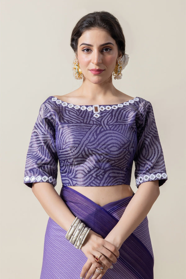 A clear front view of the Vanya Sarees designer blouse, showing the abstract print and the unique mirror work cutwork on the boat neckline.