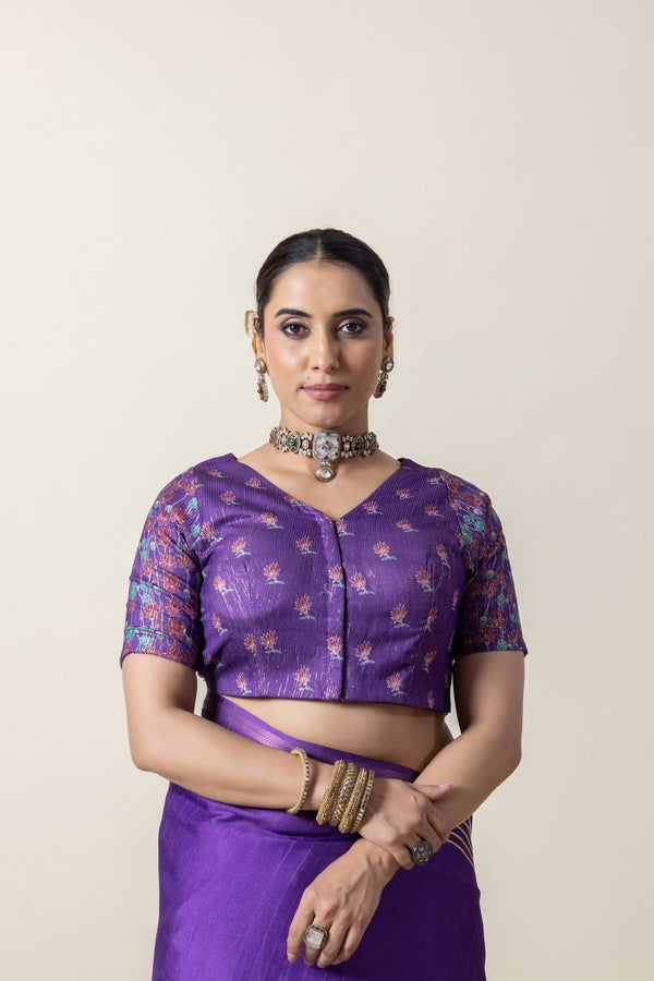 A clear front view of the Vanya Sarees readymade designer blouse in purple, showing the V-neck and delicate floral print.
