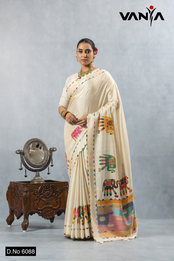A full-length view of the model in Vanya Sarees' artistic off-white cotton silk saree with a vibrant elephant print.