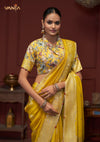 A beautiful close-up of the model in a Vanya Sarees saree, highlighting the unique shirt collar and rich floral print of the designer blouse.