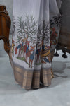 A detailed close-up of the border of the Vanya Sarees saree, showing the Kalamkari-style print of deer and birds under the Tree of Life.