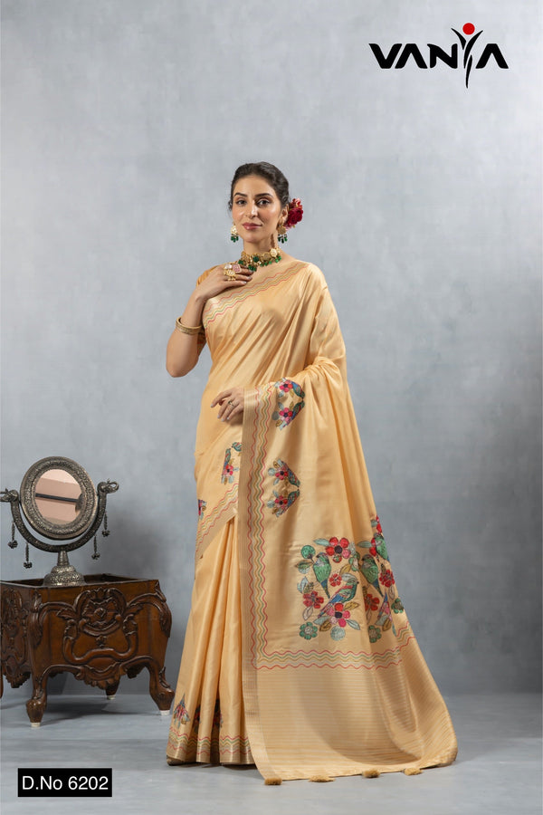 A full-length view of the model in Vanya Sarees' radiant golden yellow Chanderi silk saree with bird embroidery.