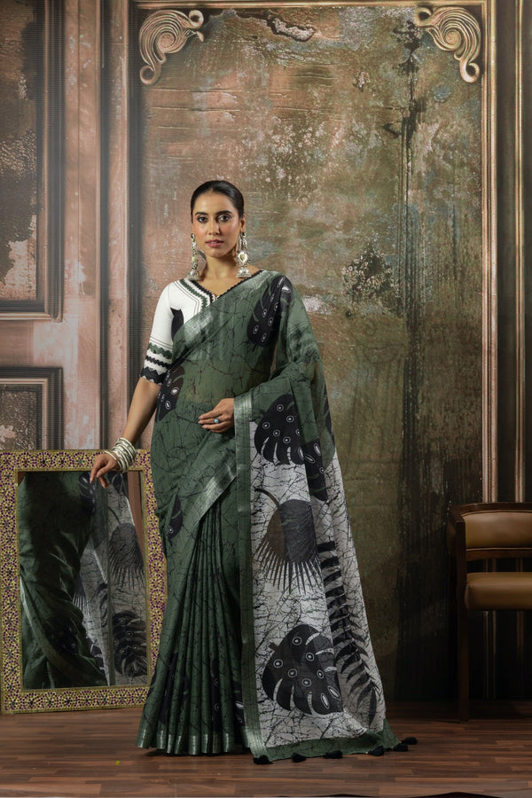 An elegant standing pose of the model in the Vanya Sarees olive green linen saree, presenting the complete designer ensemble.