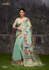 A full-length view of the model in Vanya Sarees' artistic mint green Tussar silk saree with a traditional Pichwai print.