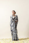 Model in a joyful pose wearing the complete Vanya Sarees grey elephant print saree, perfect for a festive look.