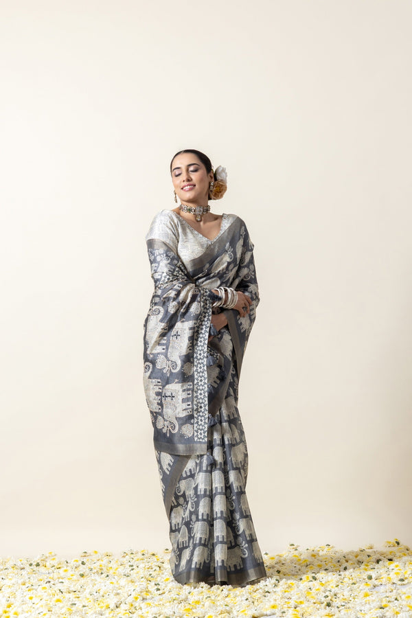 Model in a joyful pose wearing the complete Vanya Sarees grey elephant print saree, perfect for a festive look.