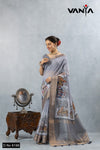 A full-length view of the model in Vanya Sarees' artistic grey Chanderi silk saree with a vibrant folk art print.