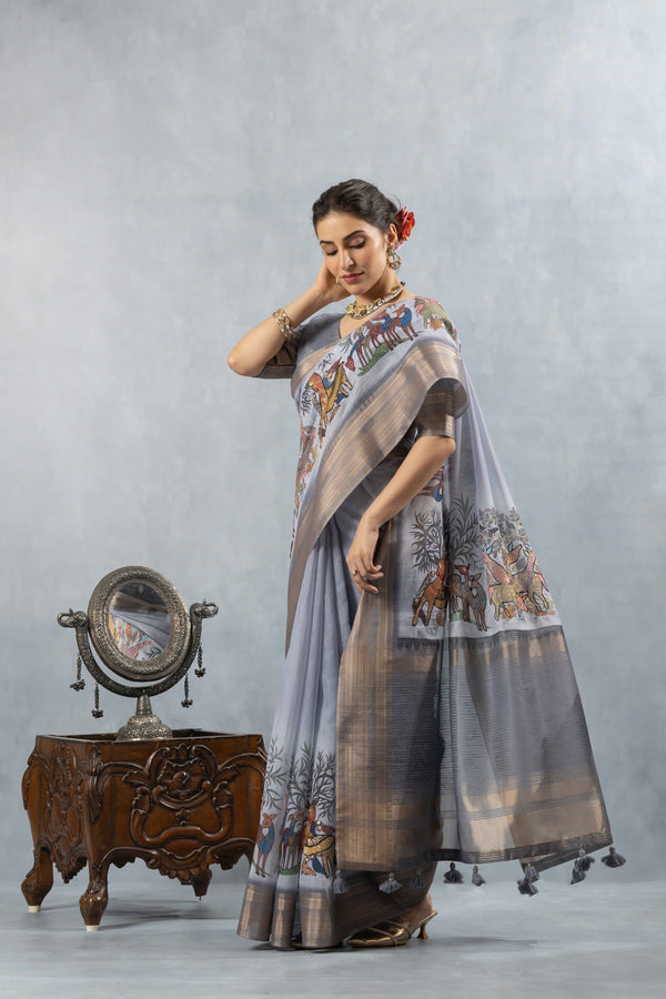 An elegant side profile of the model wearing the Vanya Sarees grey Chanderi saree, showcasing the intricate folk art print.
