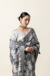 A close-up showing the beautiful drape and elephant print of the Vanya Sarees grey Modal silk saree.