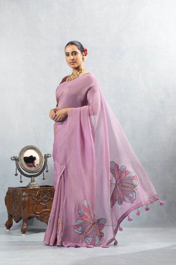Model showcasing the beautiful fluid drape and flow of the Vanya Sarees lavender georgette saree with its butterfly motif pallu.