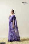 A full-length view of the model in Vanya Sarees' elegant lavender Kota Doria saree with an artistic lotus print.