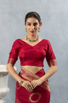 Close-up of Vanya's Maroon Art Silk V-Neck Blouse with gold zari woven trim on the sleeve cuff.