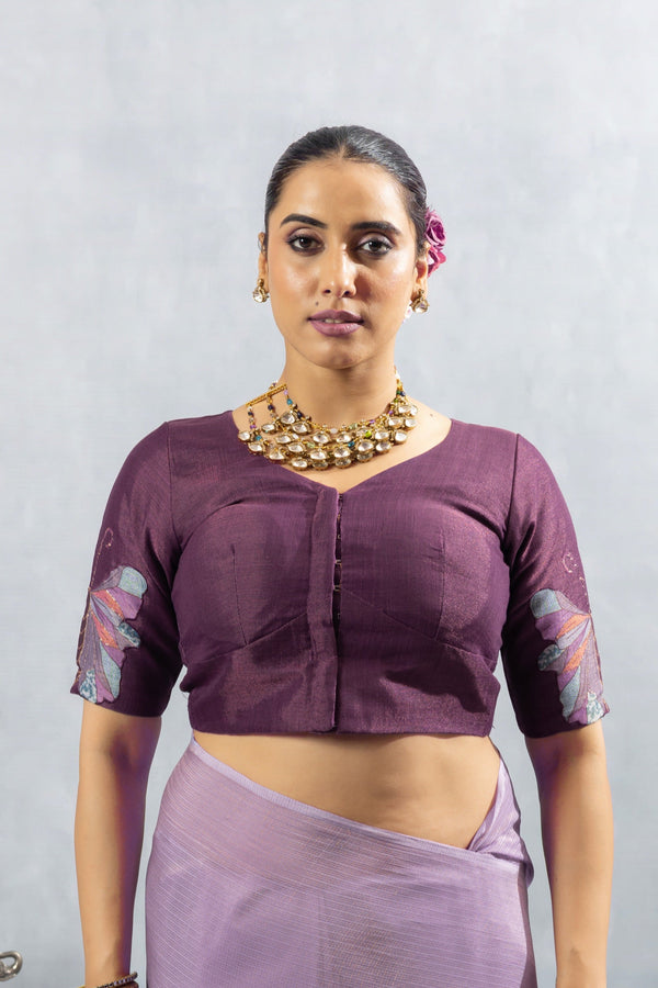 A clear front view of the Vanya Sarees readymade designer blouse in maroon, showing the V-neck and butterfly embroidered sleeves.