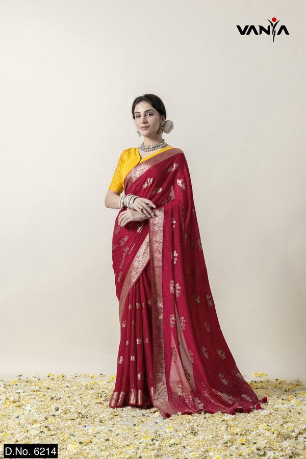 A full-length view of the model in Vanya Sarees' regal maroon and gold woven georgette saree with a contrasting yellow blouse.