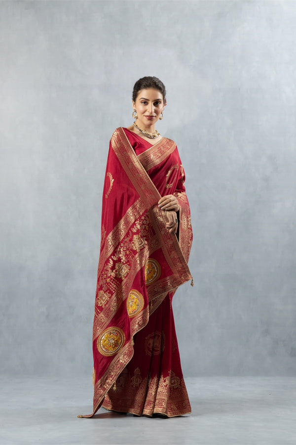 Vanya Maroon Saree in a front pose, focusing on the beautiful arrangement of the heavy gold zari pallu over the shoulder.