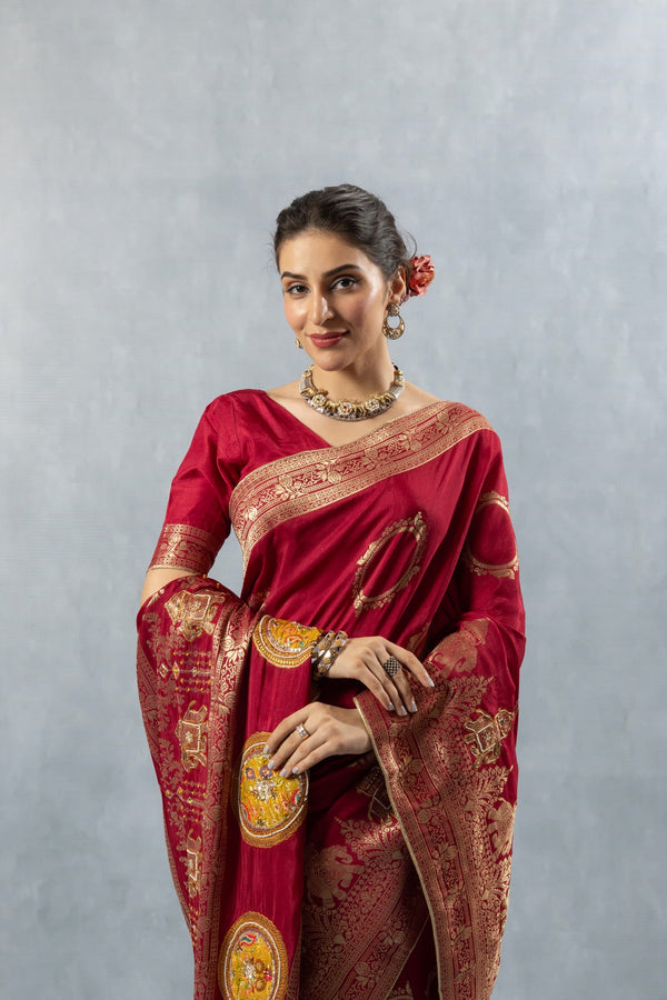 Upper body close-up of Vanya Maroon Saree, focusing on the gold zari pallu and the matching choker necklace worn by the model.
