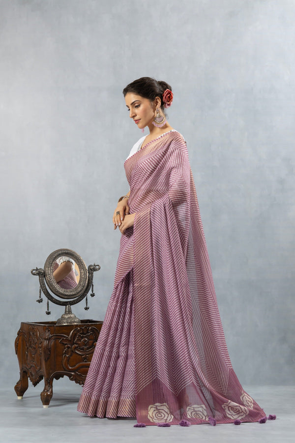 An elegant side profile of the model in the Vanya Sarees mauve Leheriya and rose print saree, perfect for a day wedding.
