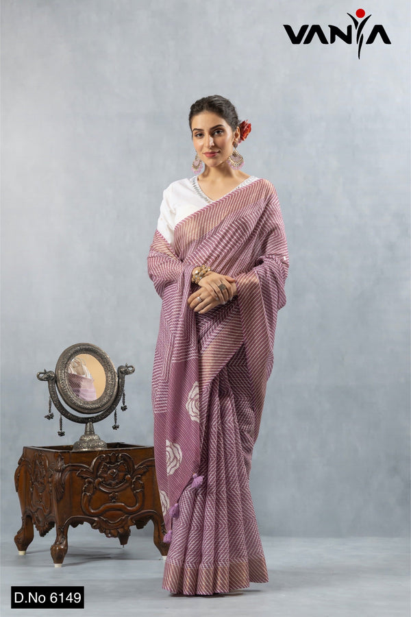 A full-length view of the model in Vanya Sarees' elegant mauve Leheriya print Kota Doria saree with a white designer blouse.