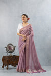 A joyful, smiling pose of the model in the Vanya Sarees mauve Leheriya saree, perfect for a festive occasion.