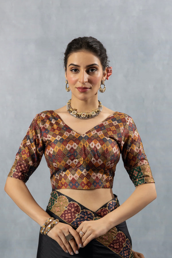 A clear front view of the Vanya Sarees readymade designer blouse, featuring a multi-color geometric Patola-style brocade.