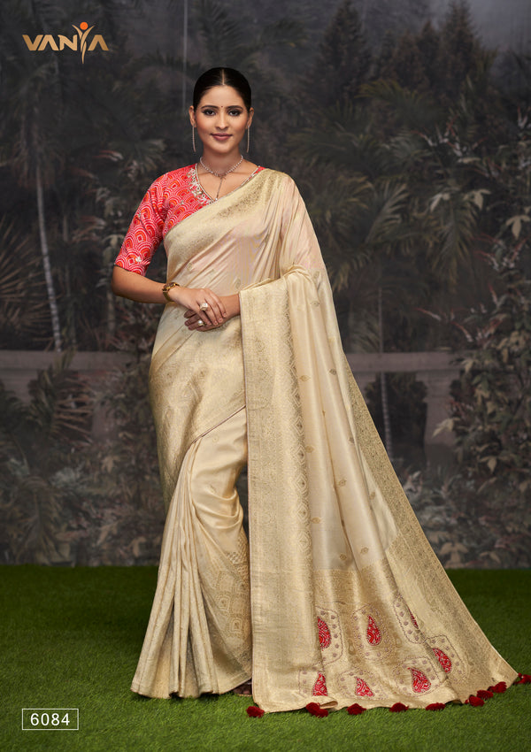 A full-length view of the model in Vanya Sarees' magnificent off-white Katan Banarasi silk saree with red Meenakari work.