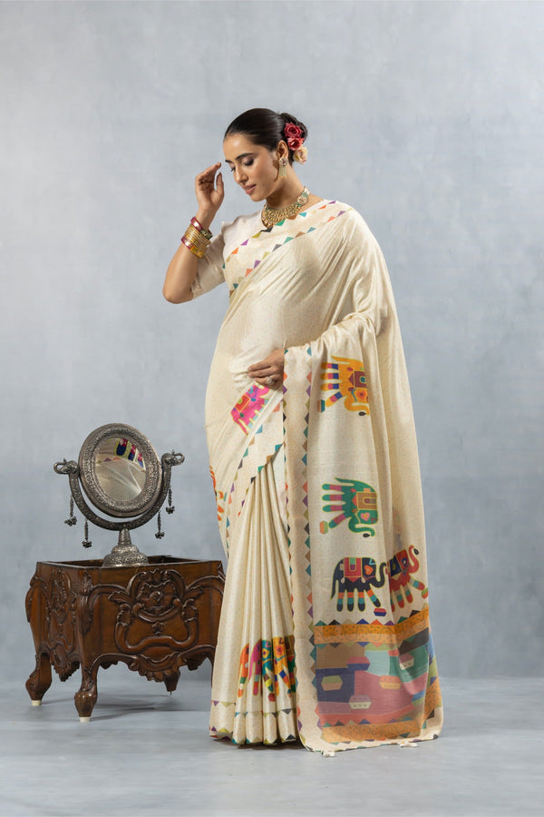 An elegant pose of the model in the Vanya Sarees off-white printed saree, showcasing the full designer ensemble.