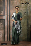 A full-length view of the model in Vanya Sarees' contemporary olive green linen cotton saree with a bold tropical print.