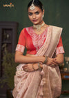 A beautiful close-up of the model in a Vanya Sarees Banarasi saree, highlighting the embroidered yoke on the red designer blouse.
