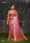 A full-length view of the model in Vanya Sarees' stunning pink and orange ombre Banarasi silk saree with a designer floral blouse.