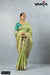 A full-length view of the model in Vanya Sarees' elegant pistachio green tissue silk saree with a gold Banarasi border.