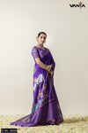 A full-length view of the model in Vanya Sarees' artistic purple Tussar silk saree with a traditional Pichwai print.