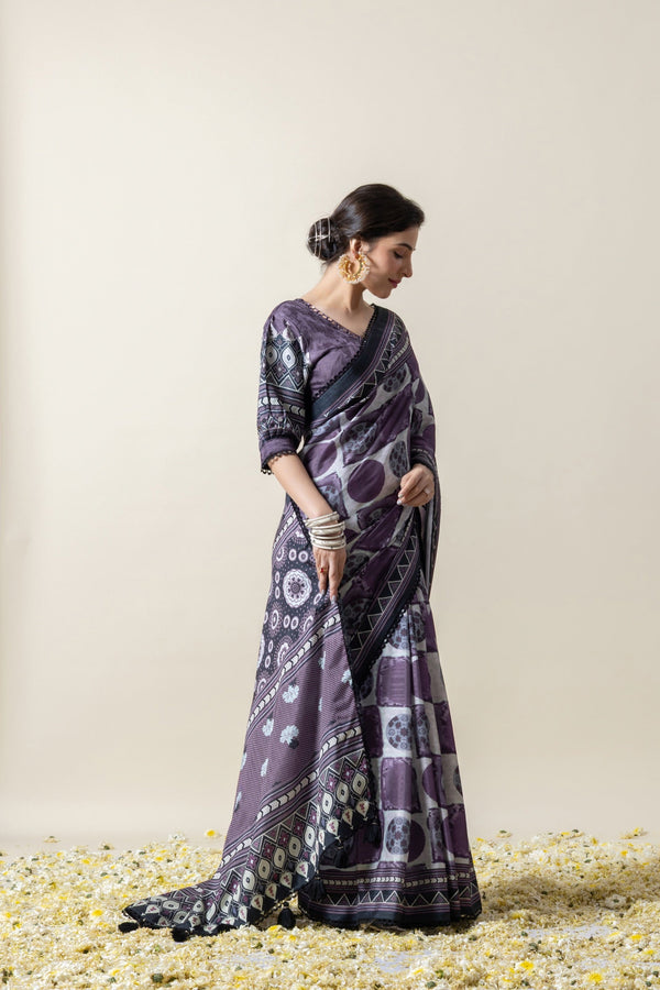 Elegant side view showcasing the beautiful drape and detailed print of the Vanya purple crepe silk saree's pallu.