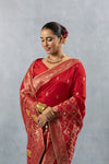 Vanya Red Saree elegant front pose, highlighting the rich fabric, subtle yellow accents in the pallu, and Kundan necklace.