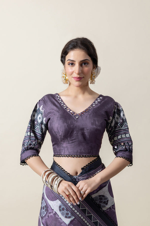 Front view focusing on the V-neck designer blouse of the Vanya saree, showing the printed pattern and lace-trimmed neckline.