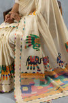A detailed close-up of the Vanya Sarees pallu, showing the multi-color elephant motifs and the unique printed temple border.
