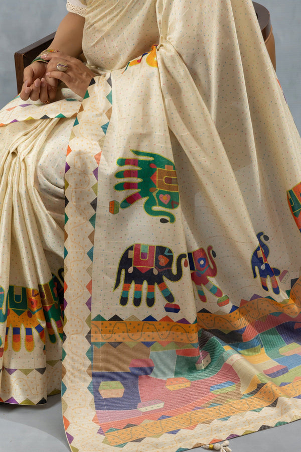 A detailed close-up of the Vanya Sarees pallu, showing the multi-color elephant motifs and the unique printed temple border.