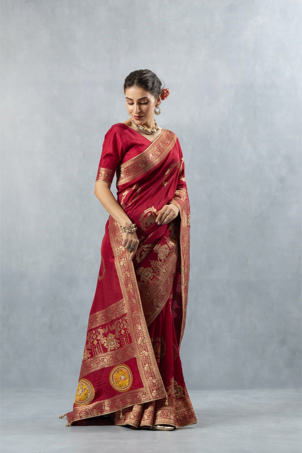 Vanya Saree side view, showing the gold zari border detail with what appears to be elephant or traditional figures motifs.