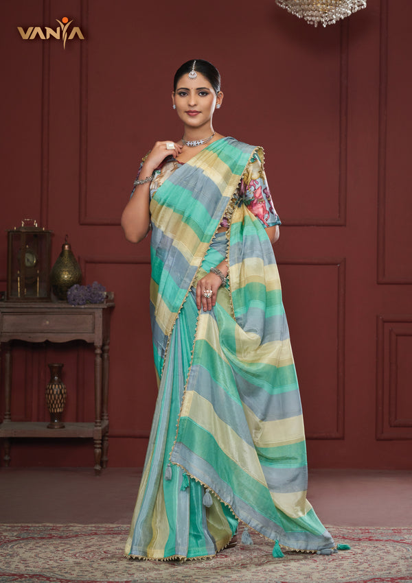 An elegant standing pose of the model showcasing the complete designer look of the Vanya Sarees multi-color striped saree.