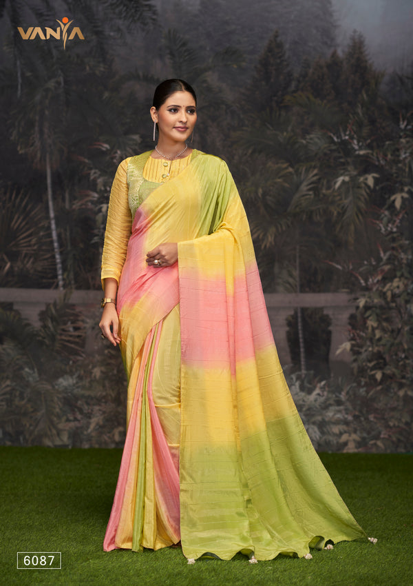 A full-length view of the model in Vanya Sarees' vibrant tricolor ombre georgette saree in green, yellow, and pink.