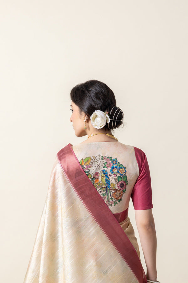 A close-up of the model's back, showing the parrot print medallion on the Vanya Sarees designer blouse.