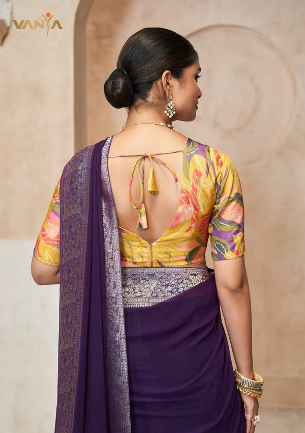 The stylish designer back of the yellow floral print blouse from Vanya Sarees, featuring a dori tie-up and tassel.